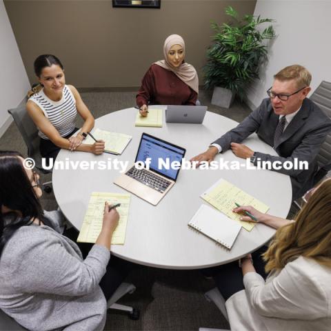 Professor Kevin Ruser meets with law students in the Immigration Clinic. College of Law Clinics. September 19, 2024. Photo by Craig Chandler / University Communication and Marketing.