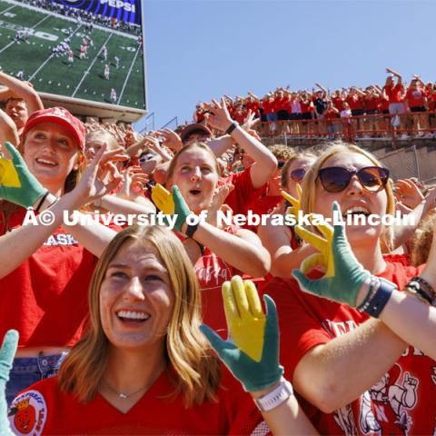 A group in the student section show off their "corn hands". Nebraska football game vs UTEP. August 31, 2024. Photo by Craig Chandler / University Communication and Marketing.