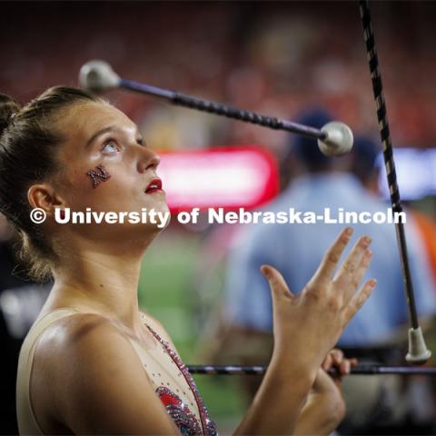 Britney Berry, one of two feature twirlers in the Cornhusker Marching Band, performs at the Nebraska vs. Illinois football game. September 20, 2024. Photo by Craig Chandler / University Communication and Marketing.