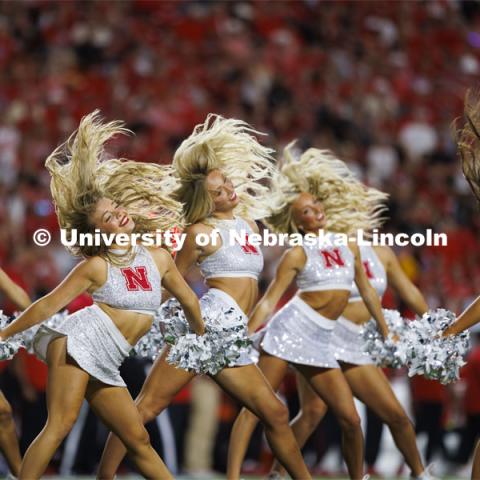 The Scarlets dance team flip their hair during a number at the Nebraska vs. Illinois football game. September 20, 2024. Photo by Craig Chandler / University Communication and Marketing.