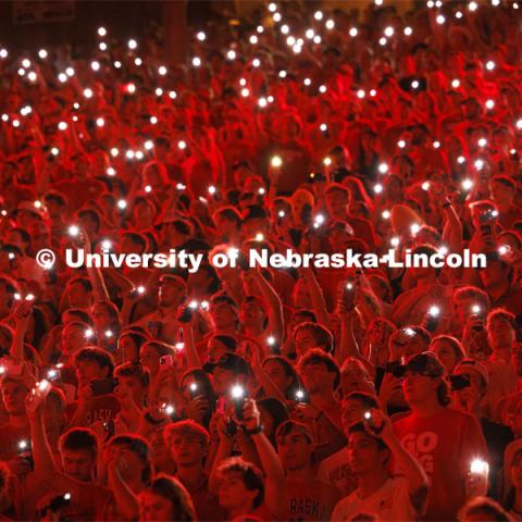 Fans illuminate a darkened stadium with their phone lights at the Nebraska vs. Illinois football game. September 20, 2024. Photo by Craig Chandler / University Communication and Marketing.