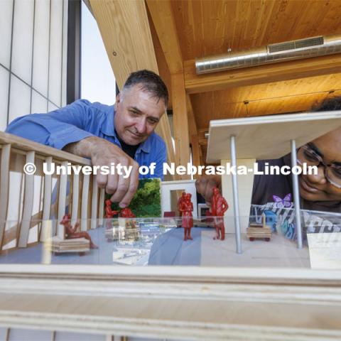 Professor Jeffrey L. Day and a student look over a model. Architecture photo shoot. September 25, 2024. Photo by Craig Chandler / University Communication and Marketing.