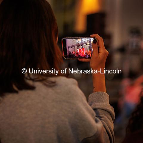 A student takes a photo with their phone at the 2024 Battle of the Bands. 2024 Homecoming celebration. October 4, 2024. Photo by Kristen Labadie / University Communication.