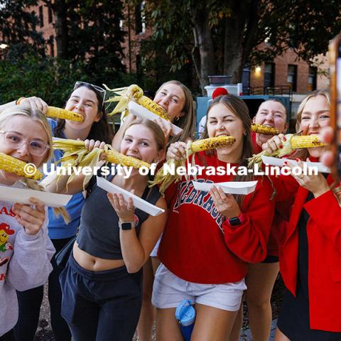 Gamma Phi Beta sorority sisters act corny for a photo at Cornchella Homecoming Parade and Cornstock. October 4, 2024. Photo by Craig Chandler / University Communication and Marketing.