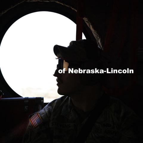 UNL Army ROTC cadets Colten Stevens is silhouetted by the helicopter window during the flight. ROTC cadets on fall exercise. October 4, 2024. Photo by Craig Chandler / University Communication and Marketing.