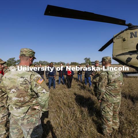 UNL advisors and professors listen to Lt. Col. Tom Slykhuis talks about the day’s field exercise with ROTC cadets. ROTC cadets on fall exercise. October 4, 2024. Photo by Craig Chandler / University Communication and Marketing.