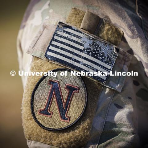 UNL ROTC arm patch on a cadet’s uniform. ROTC cadets on fall exercise.  October 4, 2024. Photo by Craig Chandler / University Communication and Marketing.