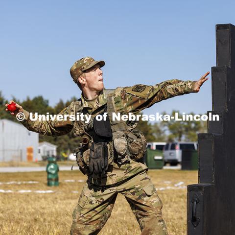 Charles Freivogel, a freshman from Omaha, throws a practice grenade during training. ROTC cadets on fall exercise. October 4, 2024. Photo by Craig Chandler / University Communication and Marketing.