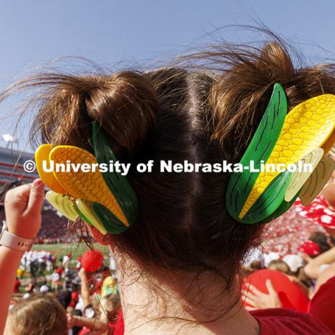 Ellie Dunn wears corn hair clips to cheer the Huskers. Nebraska vs Rutgers football game. Homecoming game. October 5, 2024. Photo by Craig Chandler / University Communication and Marketing.