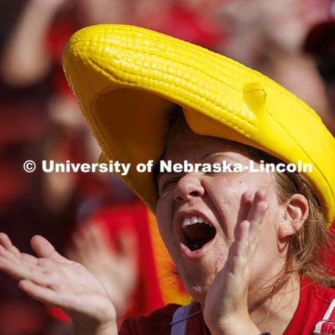 Sarah Person cheers in a more traditional corn head. Nebraska vs Rutgers football game. Homecoming game. October 5, 2024. Photo by Craig Chandler / University Communication and Marketing.