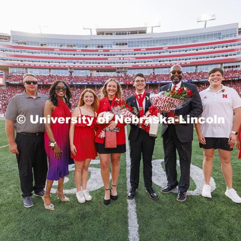 Homecoming royalty Emmerson Putnam, biological sciences major of Bellevue, Nebraska and Jaime Smith, a music education major of West Des Moines, Iowa, pose after being named in the halftime ceremony. Nebraska vs Rutgers football game. Homecoming game. October 5, 2024. Photo by Craig Chandler / University Communication and Marketing.