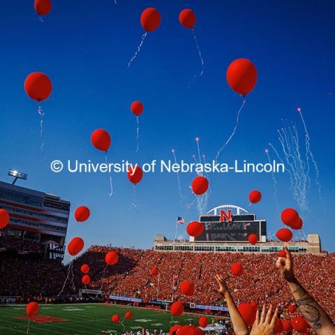 Red balloons are released at the Nebraska vs Rutgers football game. Homecoming game. October 5, 2024. Photo by Kristen Labadie / University Communication.