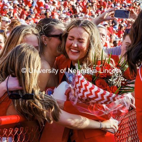 Homecoming royalty Emmerson Putnam receives a hug at the Nebraska vs Rutgers football game. Homecoming game. October 5, 2024. Photo by Kristen Labadie / University Communication.