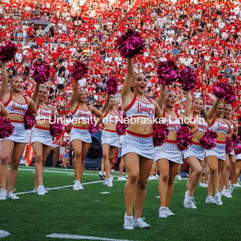 The Scarlets Dance Team performs with pink pom poms for breast cancer awareness month at the Nebraska vs Rutgers homecoming football game. October 5, 2024. Photo by Kristen Labadie / University Communication.