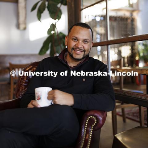 Clearthur Mangram, Director of Admissions. Photo for Nebraska Alumni. Admissions / ASEM. Mangram is pictured in The Mill coffee shop. October 10, 2024. Photo by Craig Chandler / University Communication and Marketing.