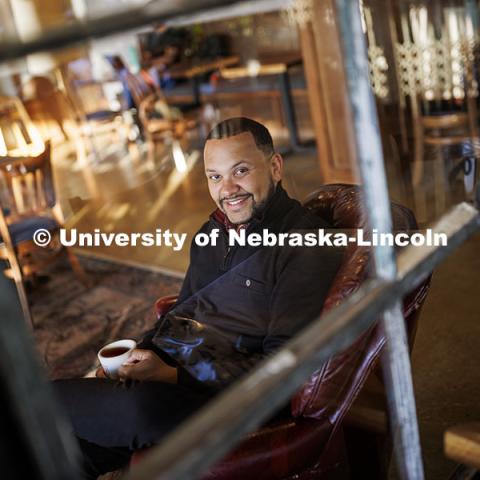 Clearthur Mangram, Director of Admissions. Photo for Nebraska Alumni. Admissions / ASEM. Mangram is pictured in The Mill coffee shop. October 10, 2024. Photo by Craig Chandler / University Communication and Marketing.