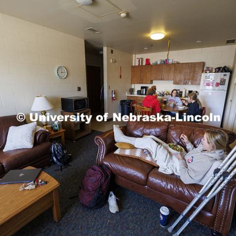 Breanna Gilmore, Sarah Dilley and McKenna Carr eat lunch together in their apartment that is part of the Animal Science building. Three student workers in the Animal Science building live in an apartment in the building. October 14, 2024. Photo by Craig Chandler / University Communication and Marketing.