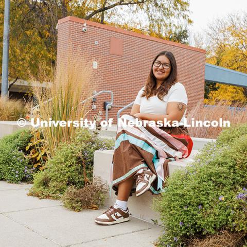 Kacyn Harlan, a Sports Media and Communication, and an Advertising and Public Relations double major poses outside the College of Journalism for Native American Heritage Month.  October 28, 2024. Photo by Kristen Labadie / University Communication.