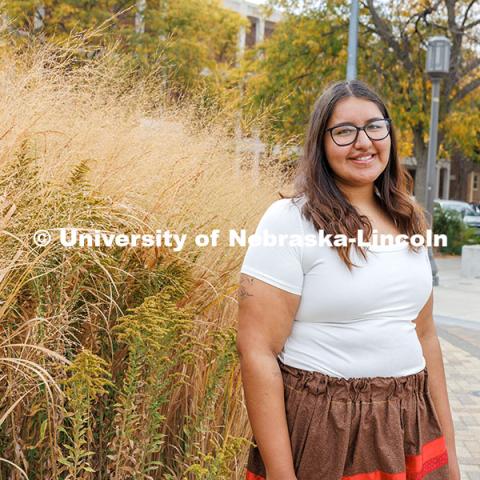 Kacyn Harlan, a Sports Media and Communication, and an Advertising and Public Relations double major poses outside the College of Journalism for Native American Heritage Month.  October 28, 2024. Photo by Kristen Labadie / University Communication.