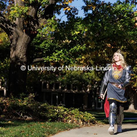 Junior geology major Nikki Elm walks on campus dressed as King Arthur for Halloween. Halloween on campus. October 31, 2024. Photo by Jordan Opp / University Communication and Marketing.