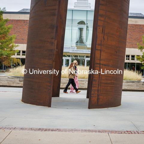 Husker fans cross campus near the Adele Coryell Hall Learning Commons on their way to the Nebraska vs UCLA football game. November 2, 2024. Photo by Kristen Labadie / University Communication.