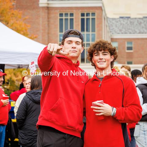 Damian Corrigan (left), a sophomore Architectural Studies major and Jackson Gwin pose for a photo at the B1G Tailgate for the Nebraska vs UCLA football game. November 2, 2024. Photo by Kristen Labadie / University Communication.