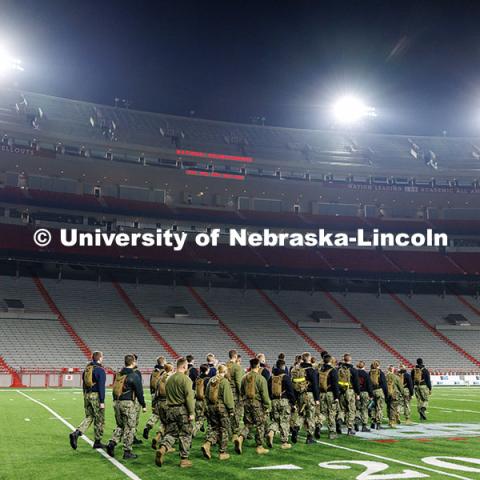 NROTC midshipmen march to the middle of the field. Navy and Marine Corps 249th birthday celebration physical training in Memorial Stadium. November 8, 2024. Photo by Jordan Opp / University Communication and Marketing.