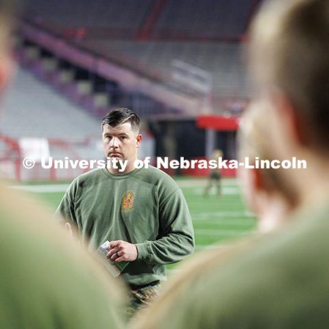 NROTC Staff Sergeant Dylon Taylor gives workout instructions to midshipmen. Navy and Marine Corps 249th birthday celebration physical training in Memorial Stadium. November 8, 2024. Photo by Jordan Opp / University Communication and Marketing.