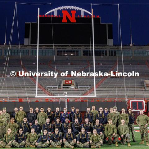 Members of the UNL NROTC pose for a photo on the field. Navy and Marine Corps 249th birthday celebration physical training in Memorial Stadium. November 8, 2024. Photo by Jordan Opp / University Communication and Marketing.