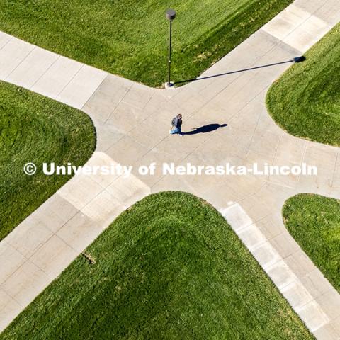 Students crossing campus on a sunny fall afternoon. November 11, 2024. Photo by Jordan Opp / University Communication and Marketing.