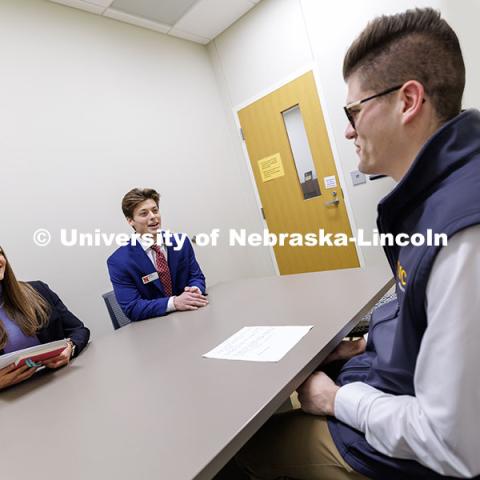 Kylie Eads and Aidan Kelch sell their product to alum Parker Merwick inside the College of Business. Fall 2024 Center for Sales Role-Play Competition. November 15, 2024. Photo by Jordan Opp / University Communication and Marketing.