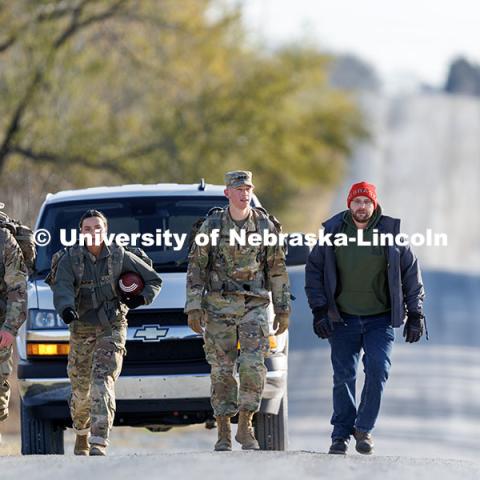 Army ROTC cadet Joe Wiese (from left), Nebraska National Guard member Cory Zelfel, cadet Malorie Mulligan, UNL Student Veterans of America treasurer Brett Klein, and cadet Max Holmstrom walk along the Missouri Pacific Trailhead near Wabash. Ruck March. November 21, 2024. Photo by Jordan Opp / University Communication and Marketing.