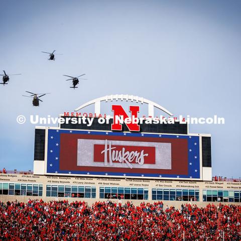 Military helicopters do a flyover at the Huskers vs. Wisconsin football game. November 23, 2024. Photo by Kristen Labadie / University Communication.