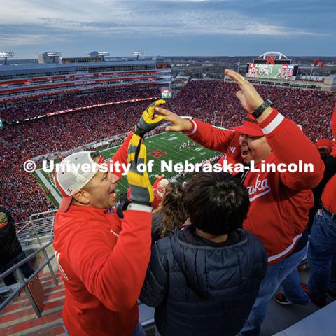 Cruz Longoria (left) high-fives Nathaniel Kage after Nebraska stops Wisconsin on fourth down during the third quarter. Nebraska vs. Wisconsin football game. November 23, 2024. Photo by Jordan Opp / University Communication and Marketing.