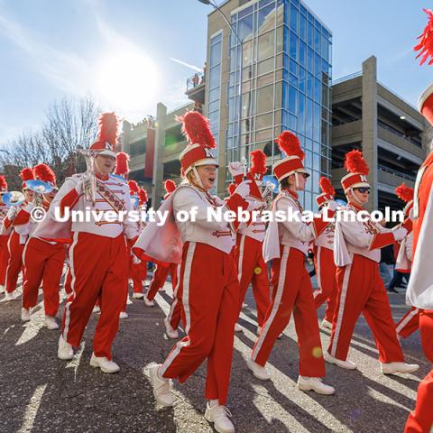 The Cornhusker Marching Band marches up Stadium Drive as the enter Memorial Stadium. Nebraska vs. Wisconsin football game. November 23, 2024. Photo by Jordan Opp / University Communication and Marketing.