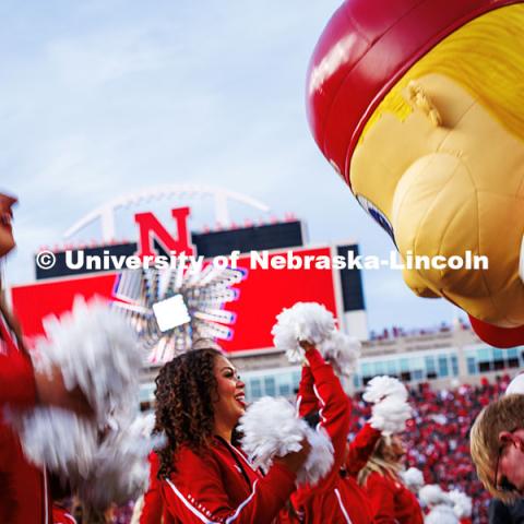 Jada Lau, a Junior Advertising and Public Relations major and Husker Scarlet interacts with Lil’ Red at the Huskers vs. Wisconsin Football game. November 23, 2024. Photo by Kristen Labadie / University Communication.