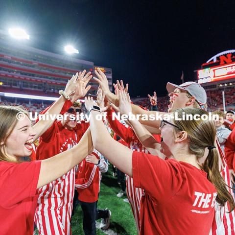 Husker fans storm the field following the team’s 44-25 win over Wisconsin to secure bowl game eligibility. Nebraska vs. Wisconsin football game. November 23, 2024. Photo by Jordan Opp / University Communication and Marketing.