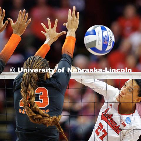 Nebraska’s Harper Murray (right) spikes the ball during round one of the NCAA Volleyball Tournament at the Bob Devaney Sports Center. Nebraska vs. Florida A&M Volleyball game. Photo by Jordan Opp / University Communication and Marketing.