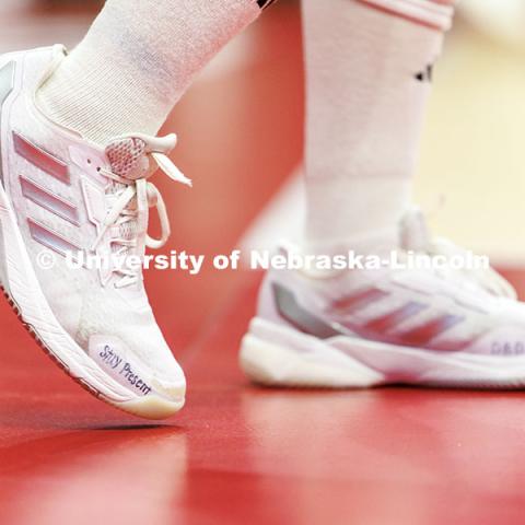 Nebraska’s Lexi Rodriguez warms-up wearing shoes with the phrase ‘Stay Present’ written on the side ahead of round two of the NCAA Volleyball Tournament at the Bob Devaney Sports Center. Nebraska vs. Miami Volleyball game. Photo by Jordan Opp / University Communication and Marketing.