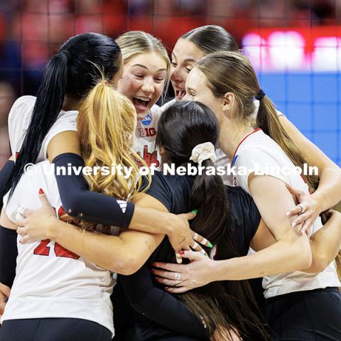 Members of the Nebraska volleyball team celebrate after scoring a point during round two of the NCAA Volleyball Tournament at the Bob Devaney Sports Center. Nebraska vs. Miami Volleyball game. Photo by Jordan Opp / University Communication and Marketing.