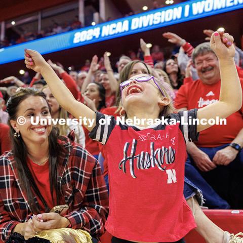 Grace Schaaret, 7, dances to "Y.M.C.A." by The Village People during a timeout in the third set of round two of the NCAA Volleyball Tournament at the Bob Devaney Sports Center. Nebraska vs. Miami Volleyball game. Photo by Jordan Opp / University Communication and Marketing.